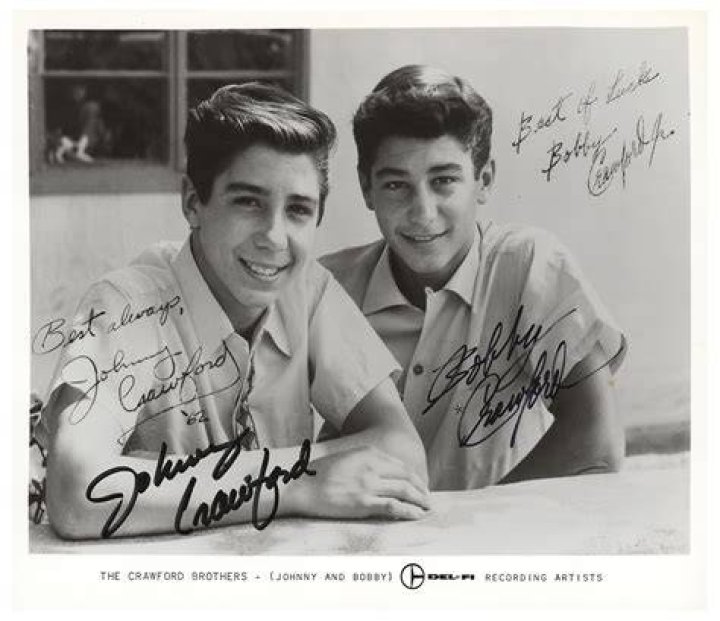 Johnny Crawford in 1997 with a photo of himself as a boy and Chuck