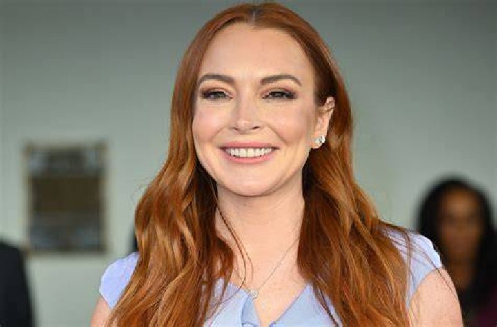 Lindsay Lohan Is Absolutely Glowing as She Cradles Her Baby Bump in New